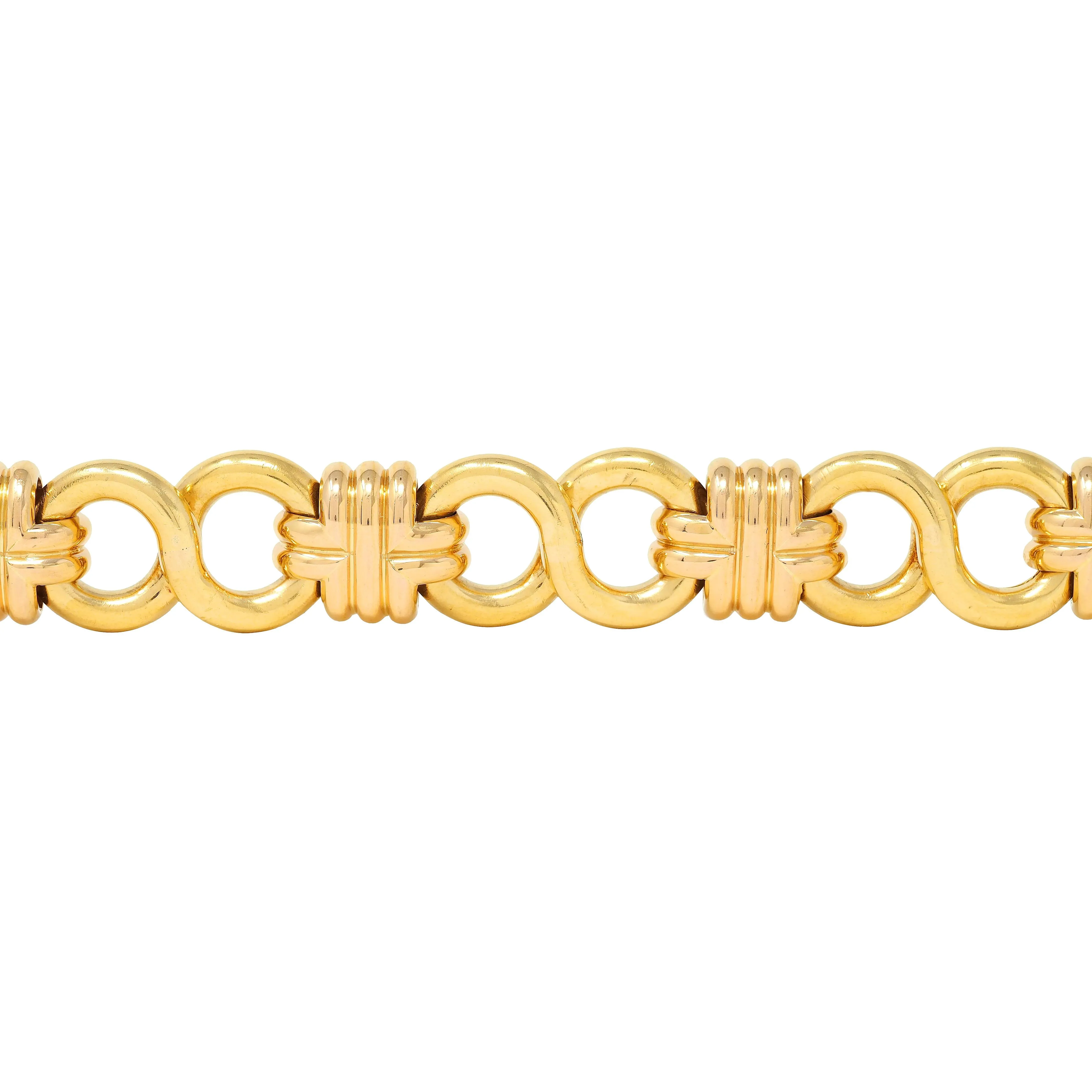 Black Starr & Frost 1980's 18 Karat Two-Tone Gold Vintage Woven Infinity Link Chain Bracelet