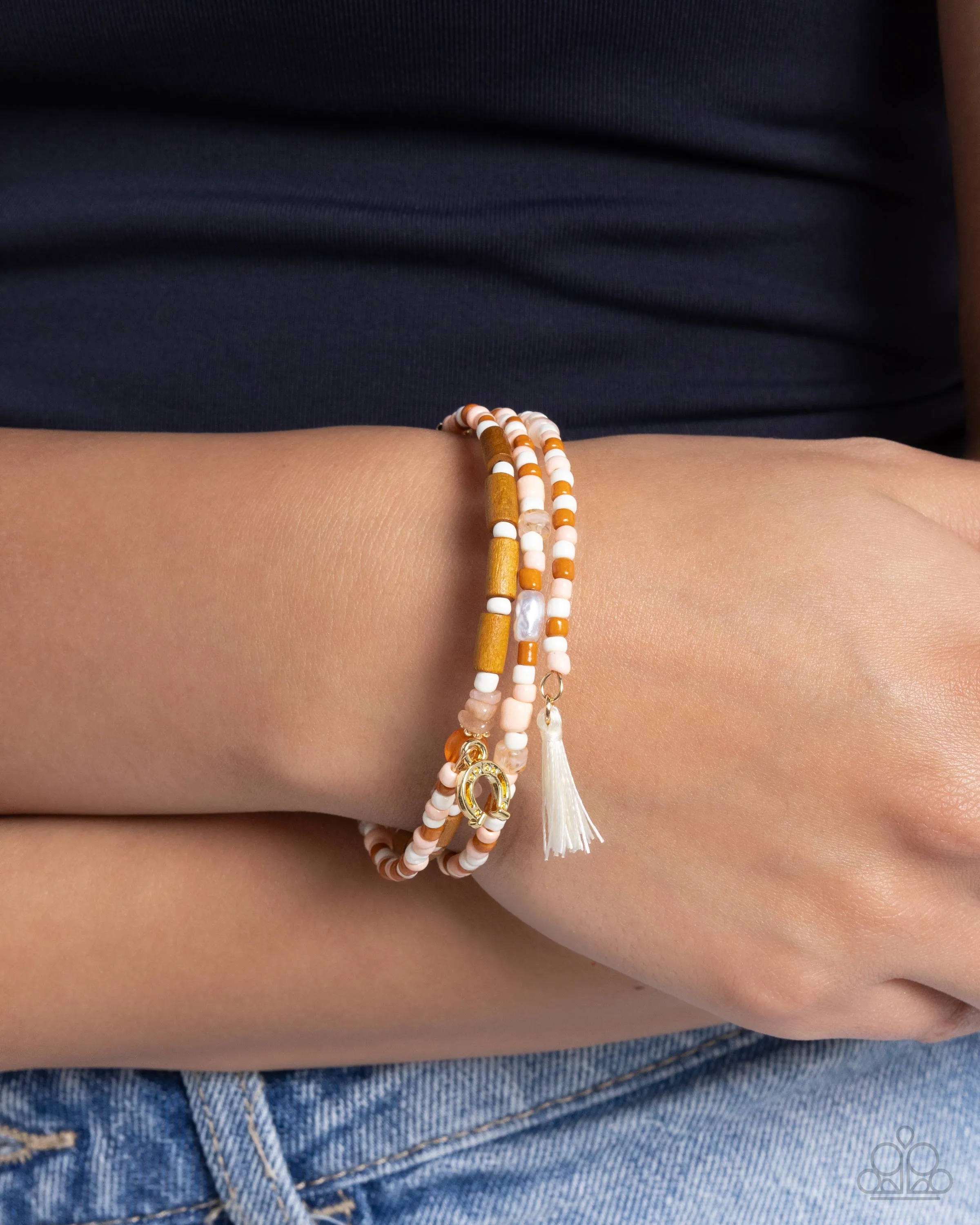 Colored Conversation - Orange - Peach, and Ivory Seed Bead with Tassel and Silver Horseshoe Paparazzi Coil Bracelet