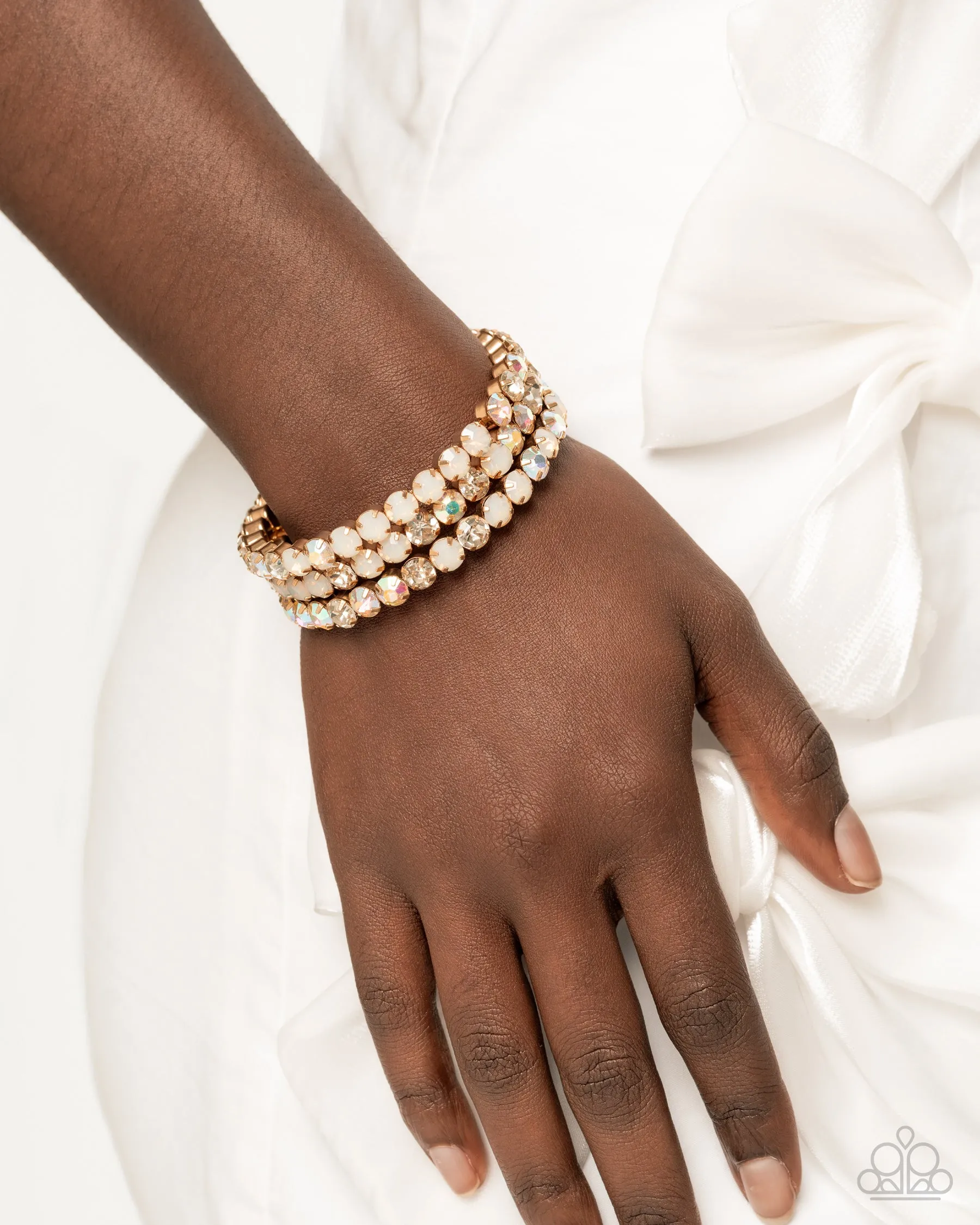 Iridescent Incantation - Multi - Gold - White, Opalescent, and Iridescent Gem Paparazzi Coil Bracelet