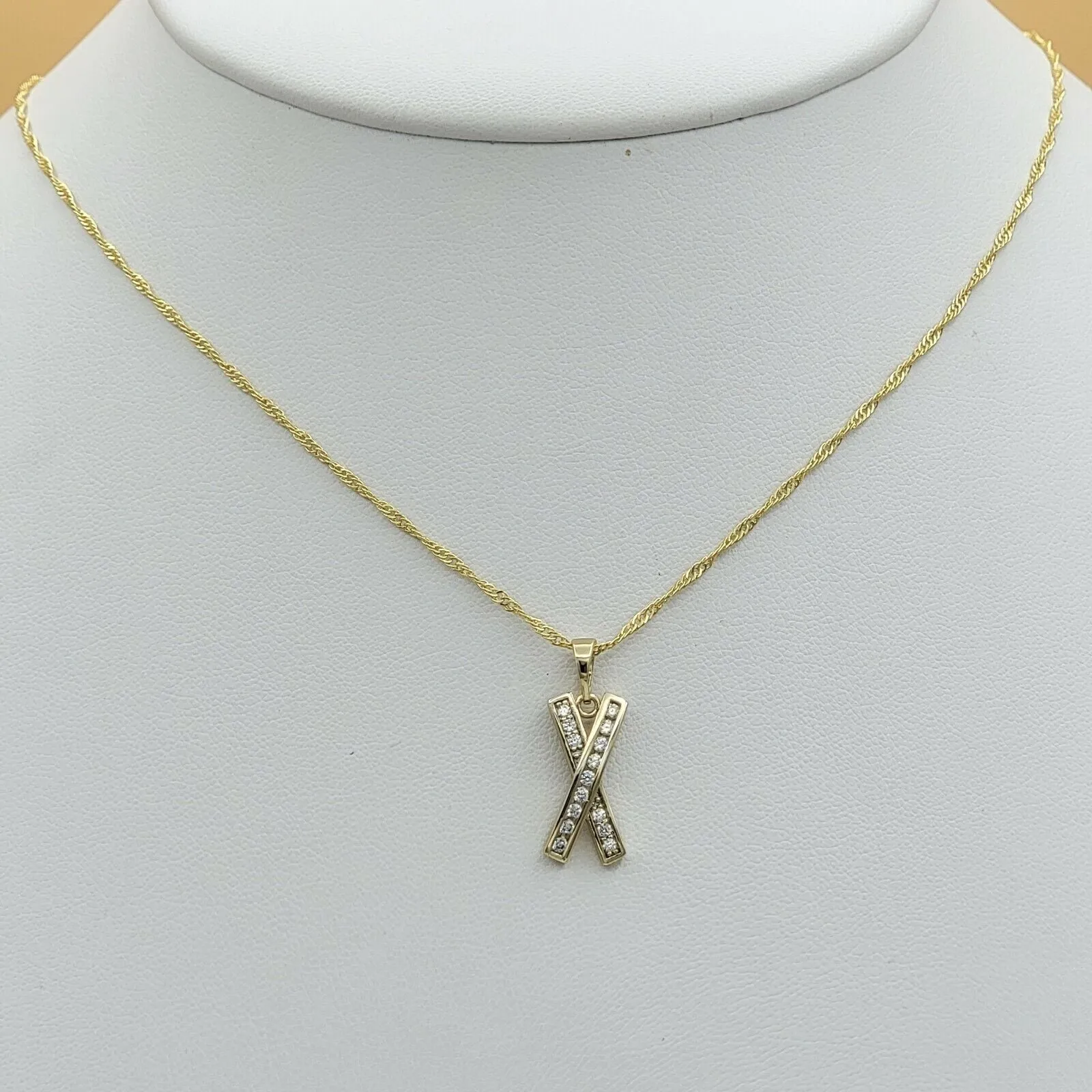 Necklaces - 14K Gold Plated. Icy crystal X Cross Ribbon Pendant & Chain.