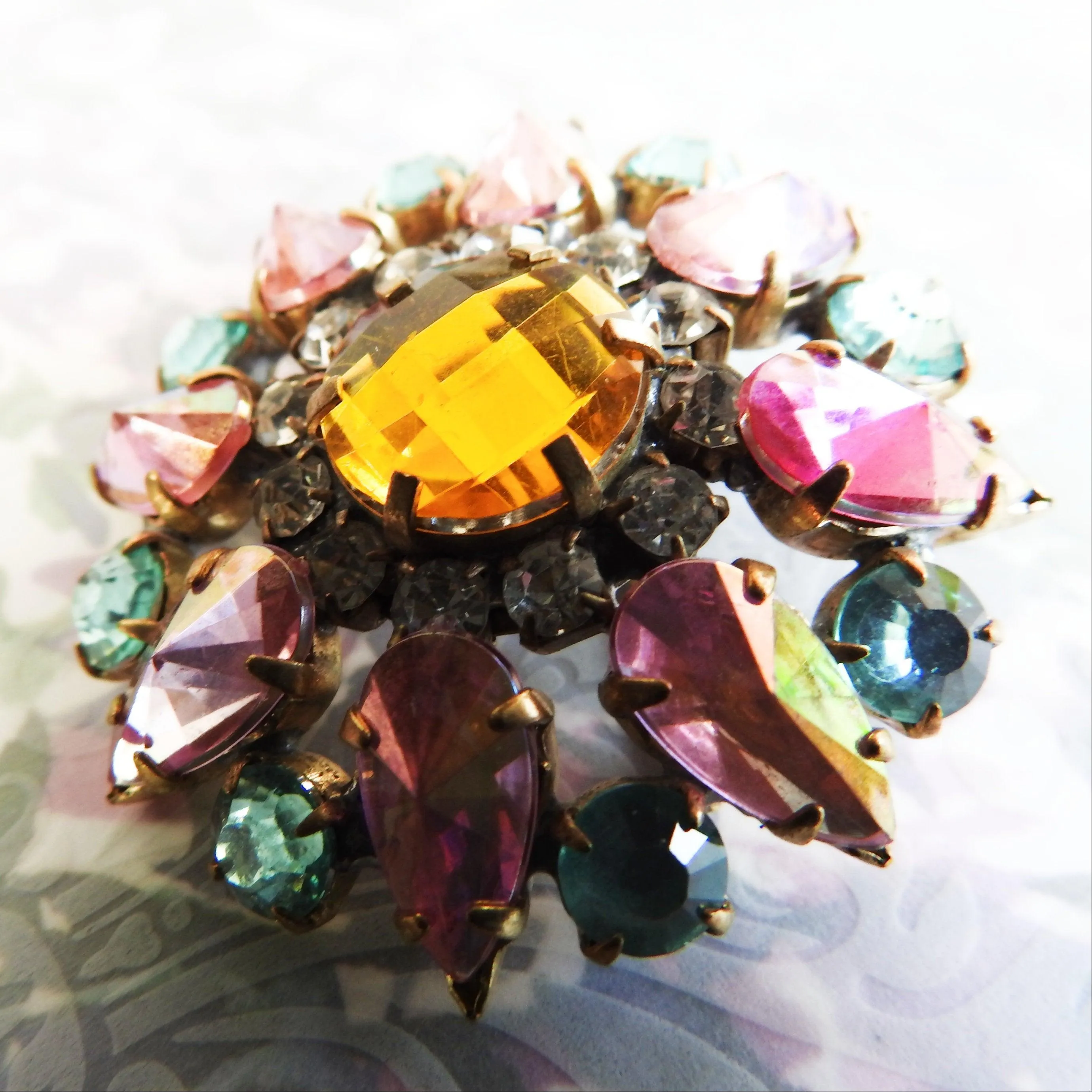 Pink and green crystal brooch