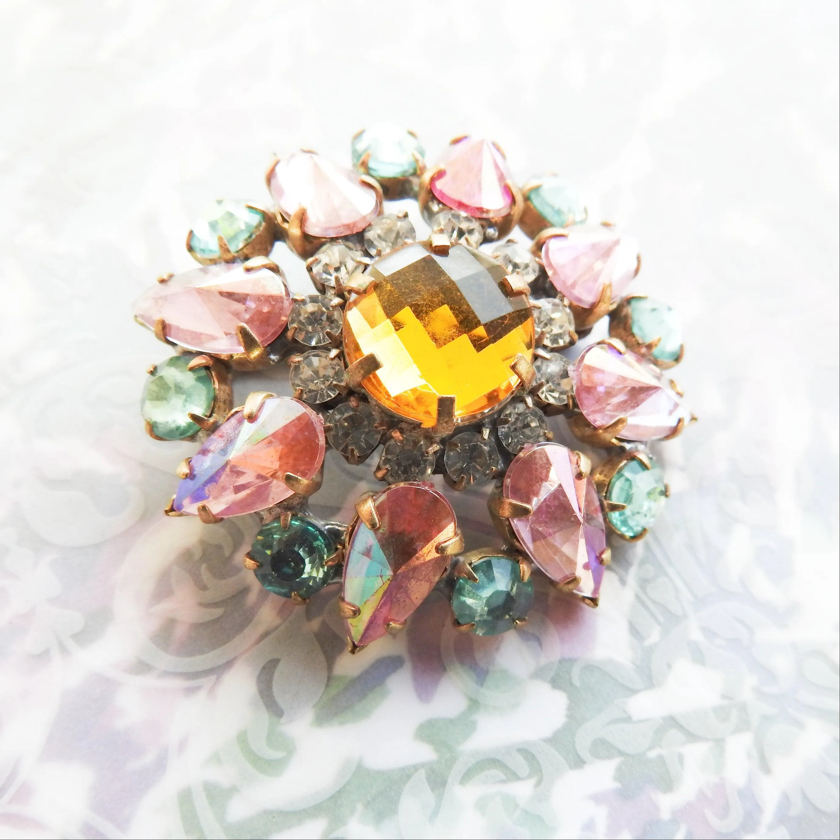 Pink and green crystal brooch