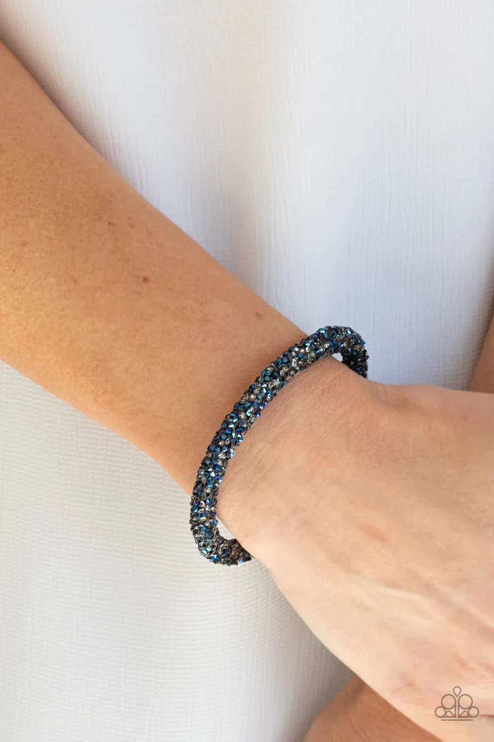 Roll Out The Glitz - Multi - Blue and Smoky Rhinestone Paparazzi Coil Bracelet