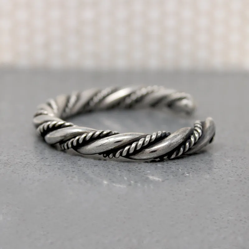 So Meta Twist within a Twist Coin Silver Cuff